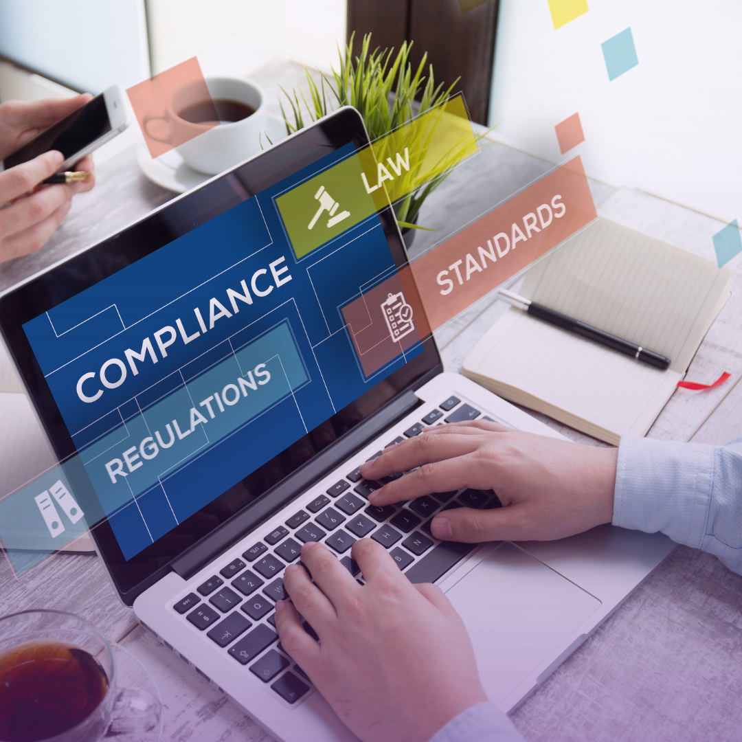 Hands type on a laptop displaying "COMPLIANCE," "REGULATIONS," "LAW," and "STANDARDS," symbolizing trust through adherence to guidelines.