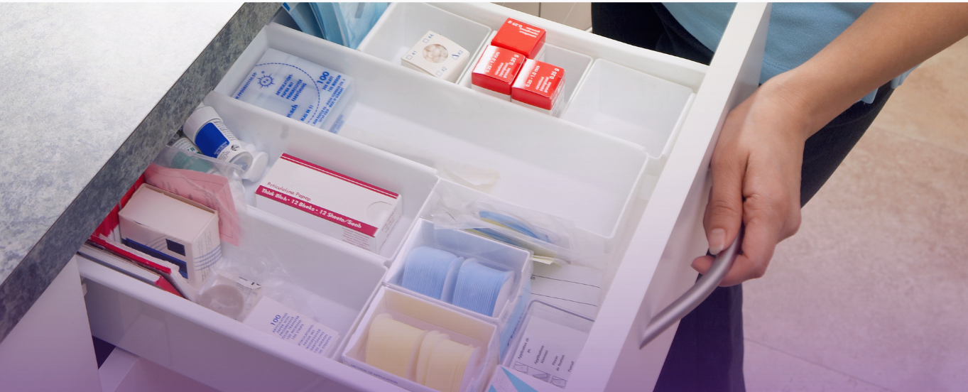 Organized drawer with medical supplies and a hand on the handle, symbolizing easy access via a customer portal.