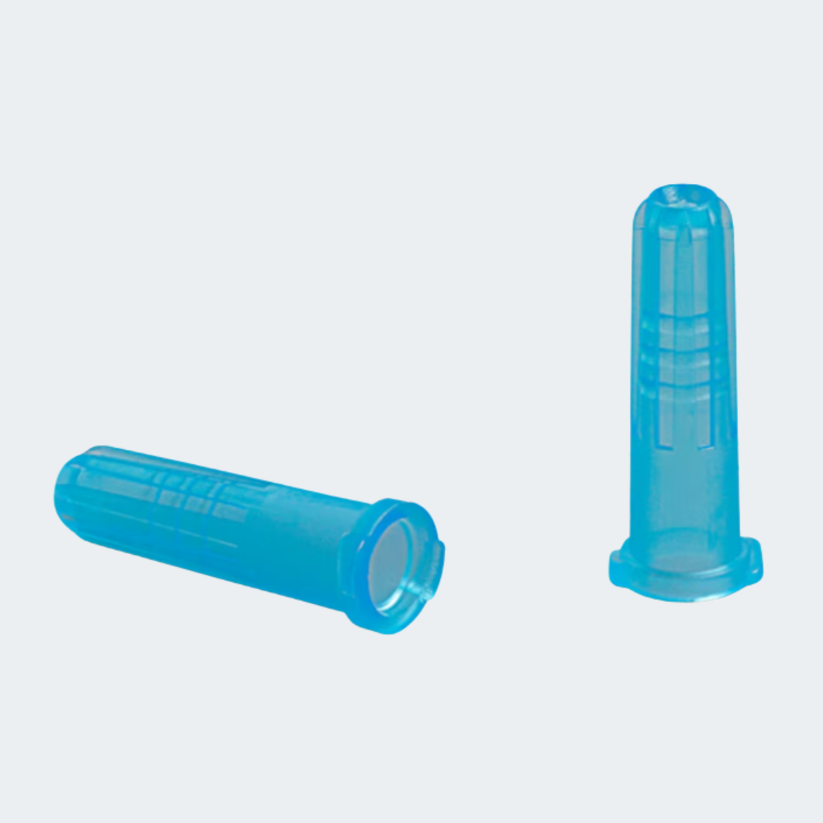 Two translucent blue plastic protective caps, one lying down and one standing upright, on a light gray background.