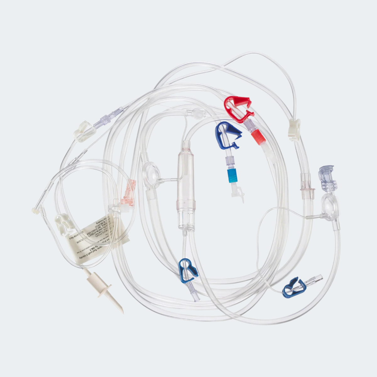 A medical IV drip set with clear tubing, a clear bag, and multiple colored plastic connectors and regulators in red, blue, and white, shown on a light gray background.