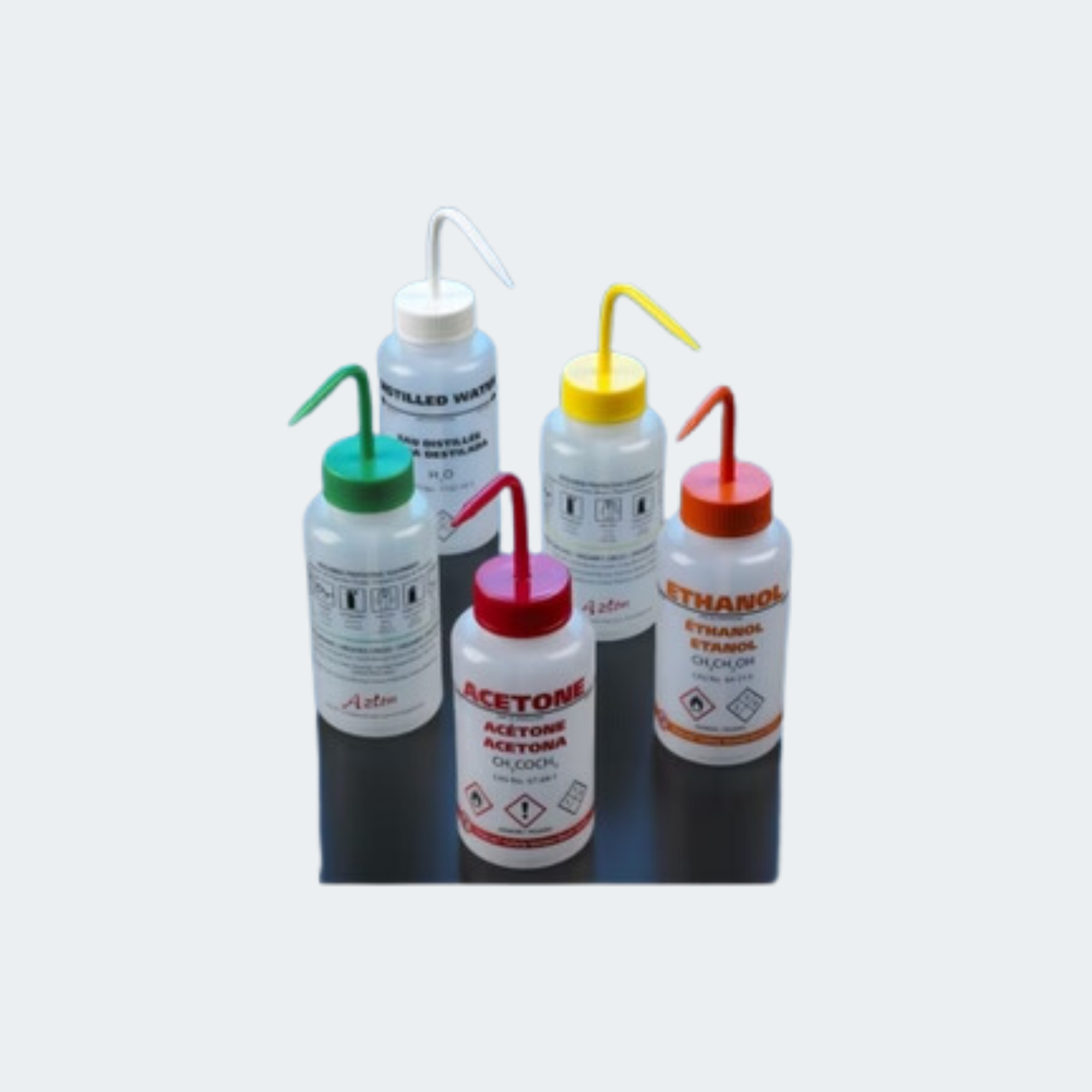 All bottles include Globally Harmonized Pictograms and signal words, NFPA diamond, risk phrases and safety information