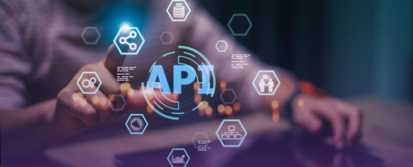 Cover photo for "Software Solutions and Integrated Technologies" featuring a hand interacting with a glowing holographic display of "API" surrounded by various data and network icons, symbolizing connectivity and digital integration.