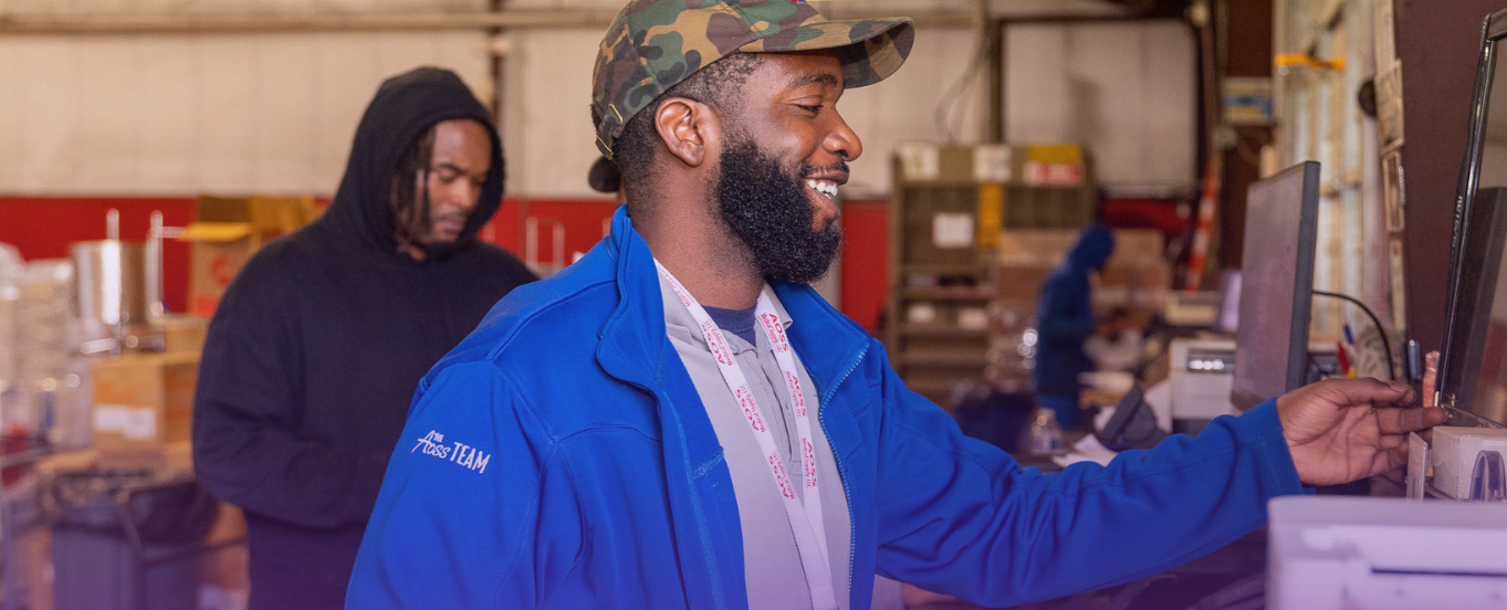 Cover photo for a "Streamline Ordering Process" page, showing a smiling warehouse worker in a blue jacket and camouflage hat operating a system, with another worker in the background, suggesting efficient operations.