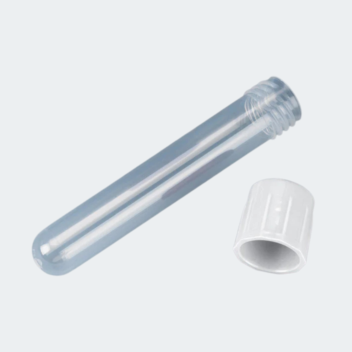 A clear plastic test tube with a threaded end, shown open with its white screw cap placed beside it on a light gray background.