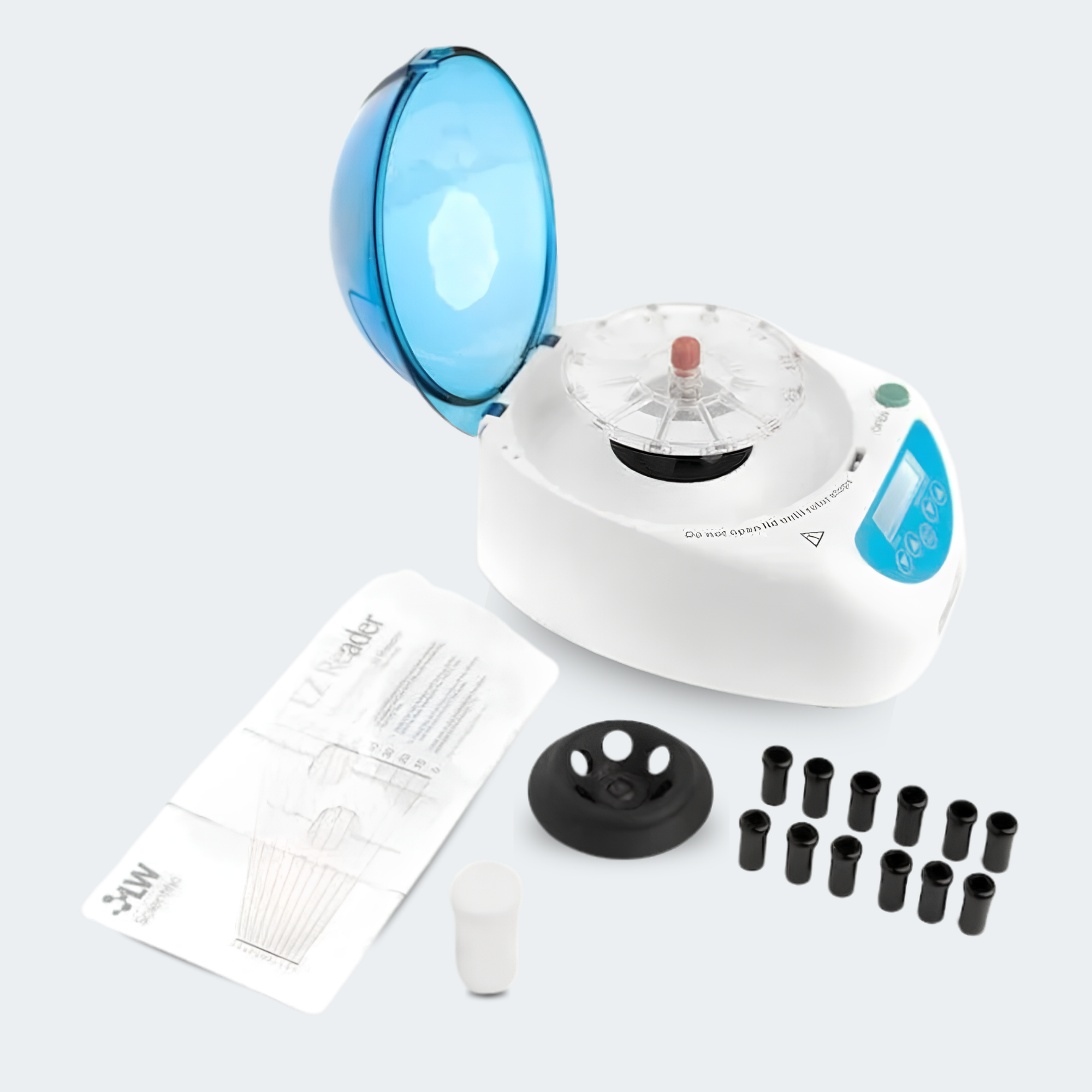 A white and blue centrifuge machine with its transparent lid open, shown with accessories including printed instruction sheets, a black lid insert, several black tubes, and a small white cap on a light gray background.