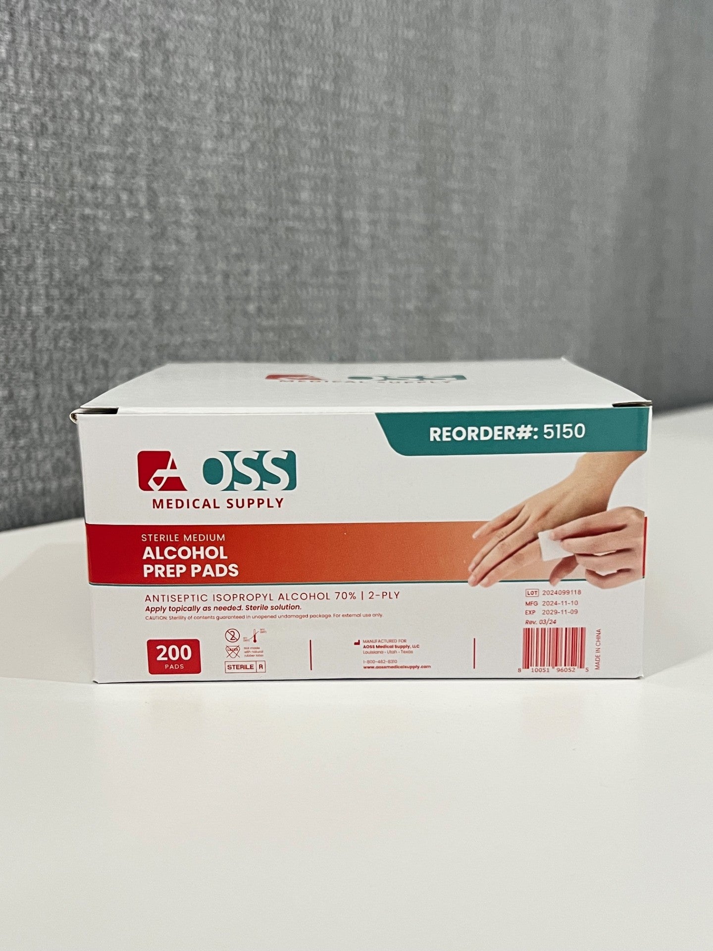 Box of OSS Medical Supply alcohol prep pads on a white surface with a gray background